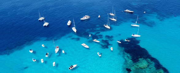 Aerial drone ultra wide photo of sailing yacht docked in paradise turquoise sea exotic island destination