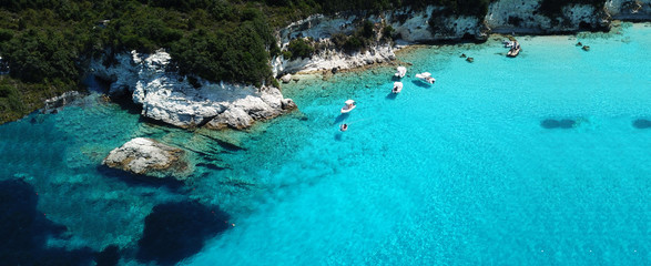 Aerial drone ultra wide photo of paradise tropical exotic white rocky deep turquoise seascape forming a blue lagoon in Caribbean popular destination