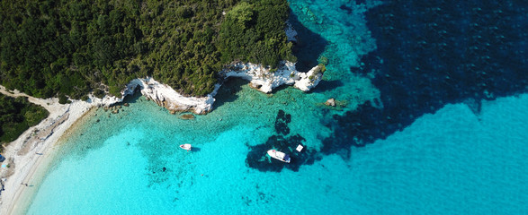 Aerial drone ultra wide photo of paradise tropical exotic white rocky deep turquoise seascape forming a blue lagoon in Caribbean popular destination