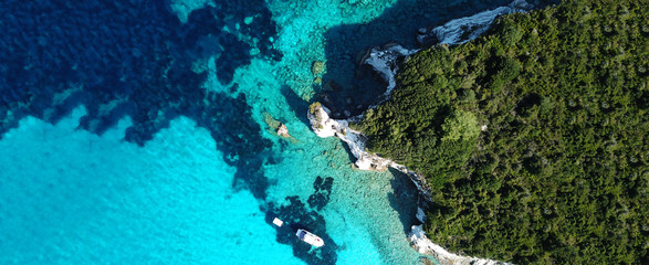 Naklejka na ściany i meble Aerial drone ultra wide photo of paradise tropical exotic white rocky deep turquoise seascape forming a blue lagoon in Caribbean popular destination