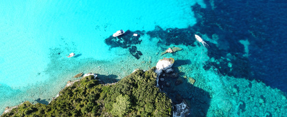 Aerial drone ultra wide photo of paradise tropical exotic white rocky deep turquoise seascape forming a blue lagoon in Caribbean popular destination