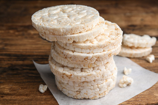 Stack of puffed rice cakes on wooden table