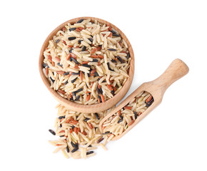 Bowl and scoop with mix of brown rice isolated on white, top view