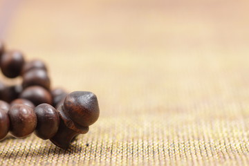 Close up shoot of a Praying beads on a sajadah (Carpet for moslem praying)