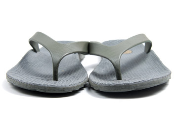 A pair of brown coffee sandals on a white isolated background