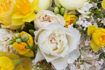 Floral backdrop, background. Flowers in bloom. White yellow bouquet with peonies roses close-up, details