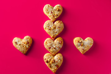 Heart shaped cookies for valentines day on pink background