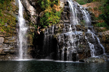 Water cascading down rugged, rocky cliffs