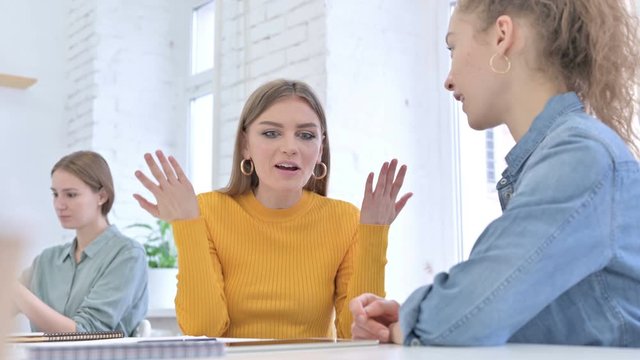 Beautiful Creative Startup Team having Conversation in Office 