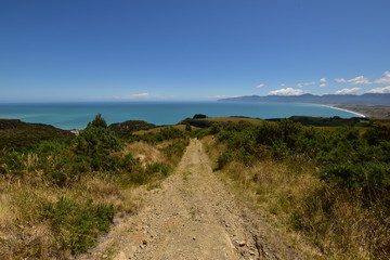 Cape Palliser bay view with gravel track in the front