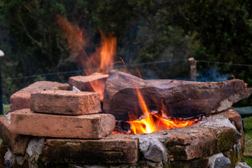 wood burning in campfire on bricks 4