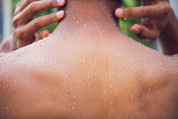 Man taking a shower ,Water drops on man skin,Shower, bathroom