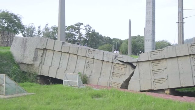 Panoramic pan right side view of entire fallen Great Stele Number 1 at the Northern Stelae Field in Aksum, Ethiopia