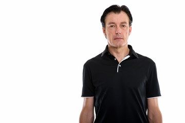 Studio shot of mature handsome man looking at camera