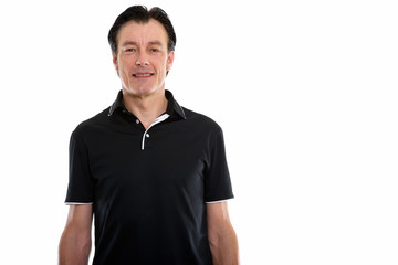 Obraz premium Studio shot of happy mature handsome man smiling
