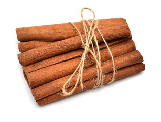 Cinnamon sticks with twine isolated on a white background. Perfectly retouched, full depth of field on the photo. Top view, flat lay