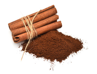 Cinnamon sticks with twine and coffee isolated on a white background. Perfectly retouched, full depth of field on the photo. Top view, flat lay