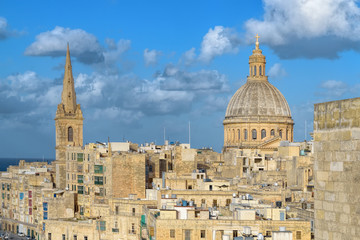 Fototapeta na wymiar Rooftops of Valletta old town with dominated by the dome of the Basilica of Our Lady Mount of Carmel. Malta.