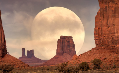 Full Moon rising on it's Perigee in Monument Valley - obrazy, fototapety, plakaty