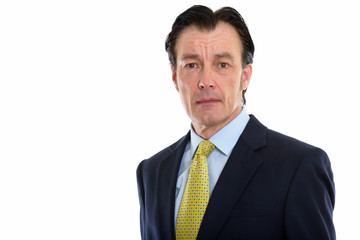 Studio shot of mature handsome businessman in suit