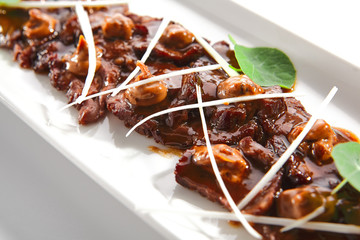 Thin Slices of Spicy Roast Beef Stew with Brown Mushroom Sauce