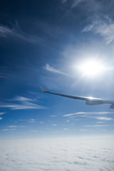 The airplane flew over the clouds.