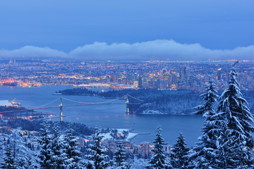 Lions Gate Bridge and Downtown Vancouver in winter with snow