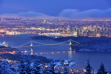 Lions Gate Bridge and Downtown Vancouver in winter with snow