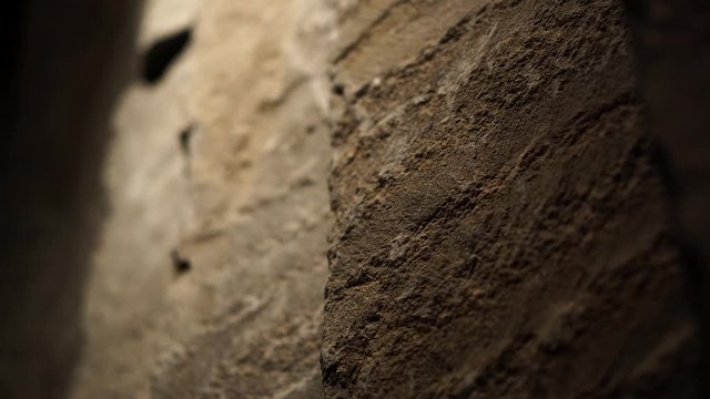 Natural rock stone wall with lighting raw loft style material