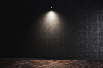 The wall lamp on the black wall. working space