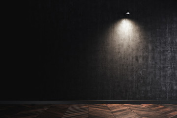 The wall lamp on the black wall. working space