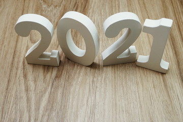 2021 Happy New Year with space copy on wooden background