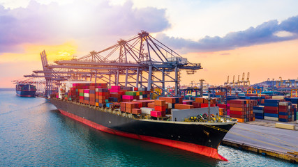 Aerial view container ship carrying container in import export business logistic and transportation...