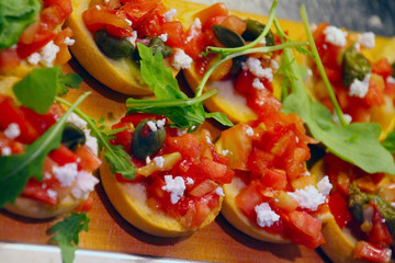 Slices with tomato feta cheese and spinach