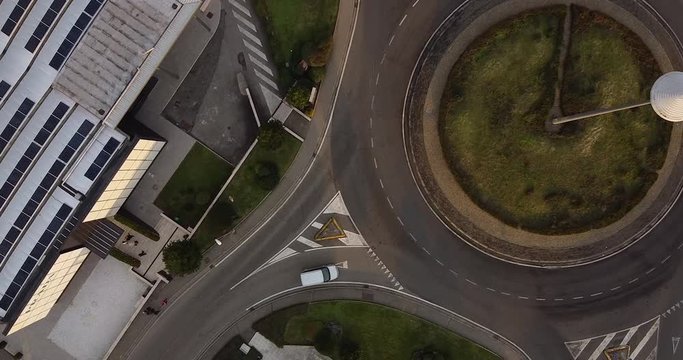 Aerial view at sunset of The Mall luxury brands store located at Leccio Reggello, Tuscany Italy. Telecommunication tower located in the middle of a roundabout close to Prada shop.
