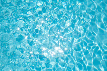 Fototapeta na wymiar ripped water in swimming pool .surface of blue swimming pool,background of water in swimming pool.