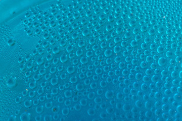 Blue water drops background close up