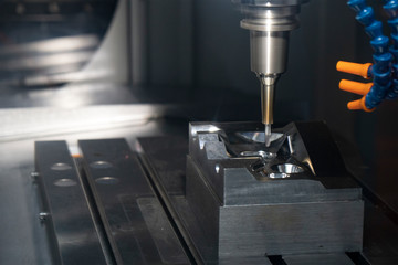 The CNC milling machine finishing cut the injection mold parts with the solid ball  endmill tools....
