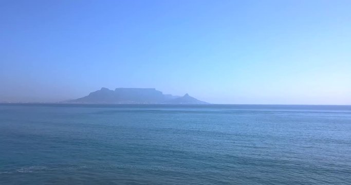 Drone flying away from Table Mountain in South Africa