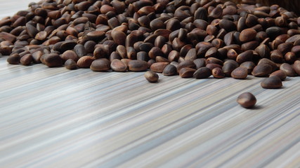 cedar nuts on a striped table