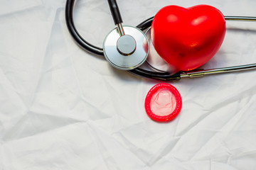 Condom and stethoscope,and red heart 