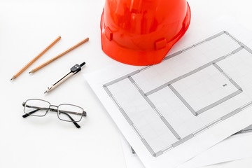 Builder helmet and blueprints on white background