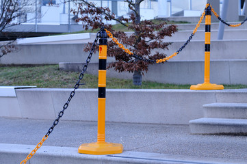 boundary of plastic posts and chain at a stairway