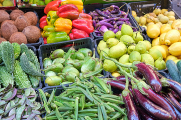 Different kinds of vegetables and lemons for sale at a market