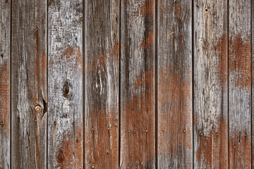 Obraz premium Old wooden boards with peeling paint. Testura from old boards with blue and red paint. Copy space, wooden background