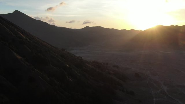 Cinematic 4k aerial video with smooth motion of mount Bromo Volcano on Java, Indonesia during sunset 