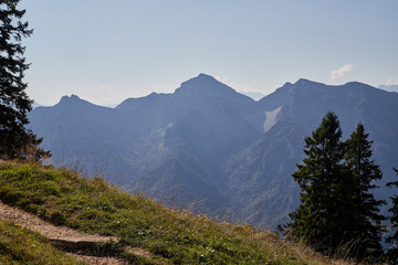 Mountain peaks visible through the trees on a good summer day