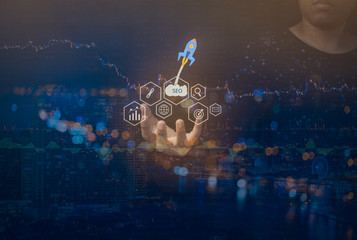 Double exposure of Person hand with SEO Search Engine Optimization concept. ranking traffic on website, internet technology for business company.