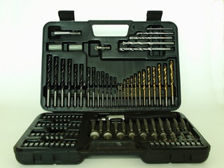 New stone, wood and metal spiral drilling bits set and screwdriver kit, DIY toolbox on white background close up