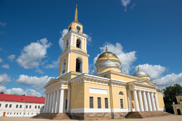 Fototapeta na wymiar Epiphany Cathedral and bell tower. Nilo-Stolobenskaya Pustyn. Is situated on Stolobny Island in Lake Seliger. Tver region, Russia